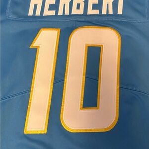 Justin Herbert. Men’s NIKE powder blue jersey.